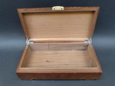 An Art Deco walnut and camphor wood box, 28 x 15 x 7.