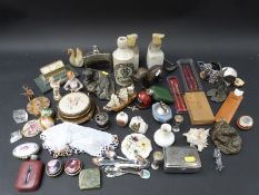 A quantity of collectibles to include compacts, hip flasks, pens,