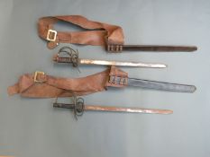 Two decorative replica swords on leather belts