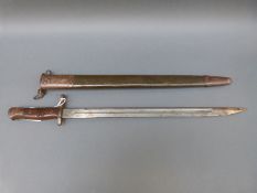 A WWI US M1917 bayonet marked 1918 to blade with green painted first pattern scabbard