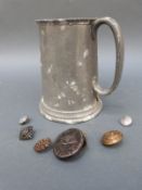 A collection of military badges including Nazi German and a pewter tankard marked HMS Ashanti