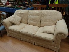 A three seat sofa with cream damask type upholstery (length 228cm)