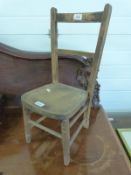 A 19th century elm seated child's or apprentice chair (height 57cm)