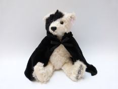 Steiff Original musical 'Phantom of the Opera' 662164 teddy bear, with white and black mohair,