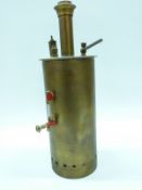 A vertical brass boiler with sight glass and centre flue