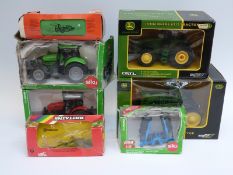 Eight Britains and Siku diecast model agricultural vehicles including John Deere, New Holland, etc,
