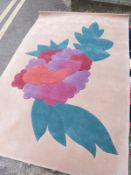 A beige wool rug with flower design (270 x 178cm)