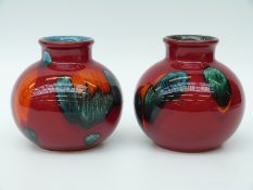 A pair of Poole pottery vases (10cm tall)