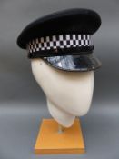 Five British peaked police caps with badges including Thames Valley,