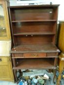 A mahogany dresser with shelves above,