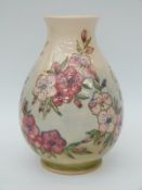 Moorcroft bulbous vase decorated with dog roses,