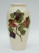 Moorcroft vase in Bougainvillea pattern by Walter Moorcroft (26cm tall)