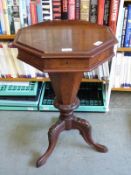 A 19thC walnut octagonal work or sewing table with hinged lid,