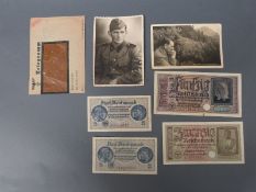 Two German postcards, one being an SS soldier marked verso Albert Lenders SS Storm FPN 44853F,