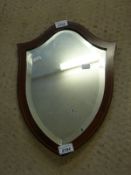 An Edwardian inlaid shield shape wall mirror with bevelled glass