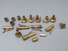 Eighteen brass powder flask tops, many named including P.Frith, G & J Hawksley, JH, James Dixon etc.