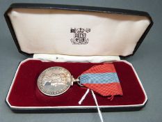 A cased Elizabeth II Imperial Service medal awarded to Leonard Charles James Brown