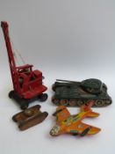 A Tri-ang tinplate Janes KL44 crane together with a Technofix friction-powered aeroplane,