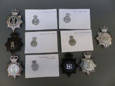A collection of various police badges including West Midlands, Warwickshire, Nottingham City,