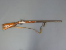 Single barrel percussion hammer action muzzle loading gun with engraved lock and hammer,