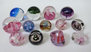 A collection of paperweights including Wedgwood and Caithness