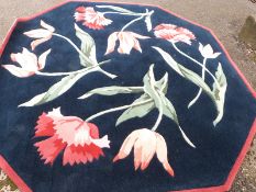 A pure wool octagonal rug with flower design,