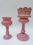 A large pink glass lustre and a smaller example