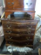 A serpentine fronted chest of four graduated drawers with brush slide raised on bracket feet (H60 x