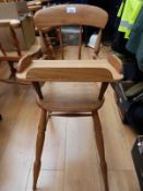 An elm Ercol style child's/doll's high chair with removable tray