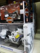 A collection of boxed diecast models including Corgi Classics, large scale model police cars,