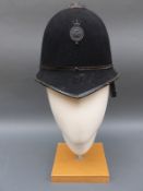 A vintage Royal Ulster Constabulary police helmet