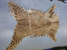A late 19th / early 20thC leopard skin rug,