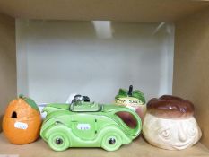 A Sadler racing car teapot, retro studio pottery figural jars, Sylvac face pots,