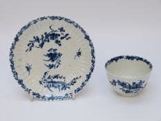 A first period Worcester tea bowl and saucer with marks to base