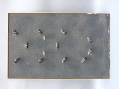 A purpose built powder flask display board with clips for 14 flasks.