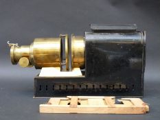 A brass and painted steel 19thC magic lantern by JW London, established 1816,