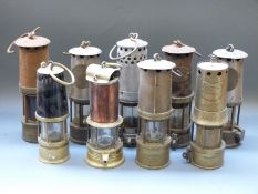 Nine various miners' lamps to include Naylor Wigan, Hulse Dresden, Howat's Patent,