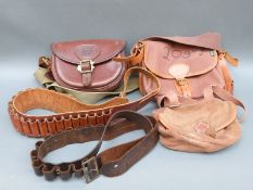 Three leather and canvas cartridge bags including one by Barbour and two 12 and 20 gauge shotgun