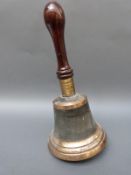 A WWII era fire bell with turned rosewood handle, believed to be Hampshire Fire Brigade,