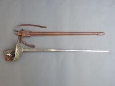 A 1912 pattern cavalry officer's sword in scabbard with leather frog attachment.