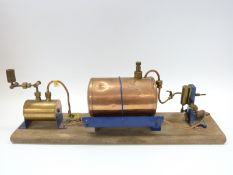 A live steam marine engine on wooden base with gas fired copper boiler and single action
