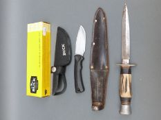 A boxed Buck knife and a further hunting knife