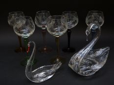 Six cut glass hock glasses with harlequin stems and two glass swans