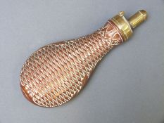 James Dixon & Sons copper and brass powder flask with embossed geometric and acanthus leaf