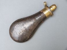 Sykes Extra Quality powder flask with embossed leather covered metal body and brass top, 20cm long.