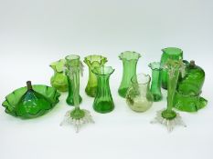 Eleven pieces of green glassware including Loetz style vases, enamelled jug,