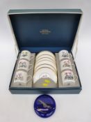 A Royal Worcester boxed coffee set with botanical decoration and a Bristol Blue Concorde