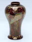 Crown Devon lustre ware vase with butterfly decoration on burgundy ground (22cm tall)