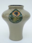 Moorcroft vase with peacock feather design,