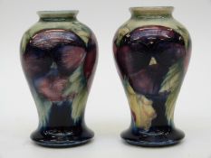 A pair of William Moorcroft Burslem vases in the early Pansy pattern, c1920 (9.